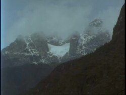 WA cloud lifting off snow covered mountains, Uganda, Africa Stock Footage