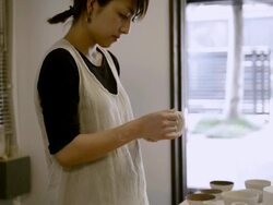 MS TD Shot of female potter confirm wooden bowl in studio / Kyoto, Japan Stock Footage