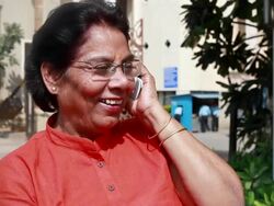 Cheerful Indian Senior Woman on the Phone Outdoors Stock Footage