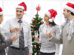 Business people in Santa cap holding flutes with champagne. Stock Footage