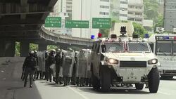 CLEAN : Police, demonstrators clash at Caracas protest News Clip