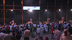 Diwali participants perform puja while a crowd looks on during Diwali. Stock Footage