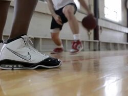 MS Two young men playing basketball against each-other inside  gymnasium / Minneapolis, Minnesota, United States  Stock Footage