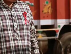 Doctor making aware a truck driver from AIDS, Ballabgarh, Haryana, India Stock Footage