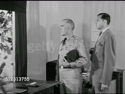 1951: EMERGENCY PREPAREDNESS: DRAMATIZATION: 'Colonel' standing by window looking outside at emergency power generator while 'city official' explains what's out there. Civil Defense Plan, The Red Scare, McCarthyism. Instructional Video