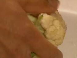 Woman washing cauliflower Stock Footage