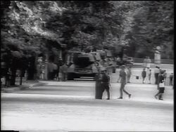 B/W 1961 people walking + tanks on city street / Berlin / after construction of Berlin Wall Stock Footage