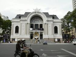 WS View of Royal Opera House with traffic moving on street / Ho Chi Minh, Vietnam Stock Footage