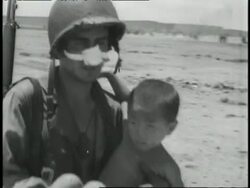 American soldiers lift women and children onto tanks in Saipan. Stock Footage
