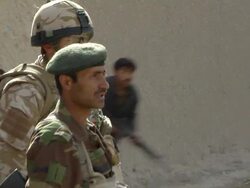 WS ZO Soldiers with rifles / Musa Qala, Helmand Province, Afghanistan. Stock Footage