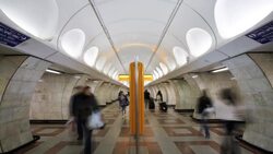Commuters walk through a modern underground station in Prague, Czech Republic. Stock Footage