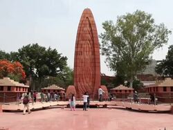 MS ZI Tourists at martyrs monument at Jalianwala Bagh / Amritsar, Punjab, India Stock Footage