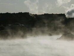 MS Steam blowing by volcanic rocks at hot spring / Haukadalur, Haukadalur, Iceland Stock Footage