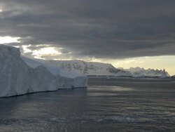 WS POV View of tabular icebergs along west coast at dusk / Antarctic Peninsula, Antarctica Stock Footage