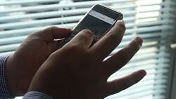 Businessman analyzing data on mobile Stock Footage