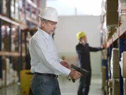 Warehouse Supervisor Using Bar Code Reader Stock Footage