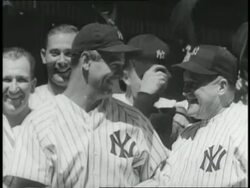 Lou Gehrig smiles and stands with New York Yankees Manager Joe McCarthy then goes on to bat and run the bases in Yankee Stadium. Stock Footage