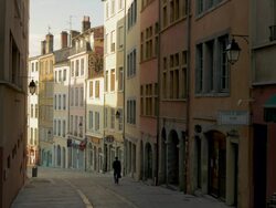 Pentes de la Croix-Rousse,Lyon,Man walking down hill,WS Stock Footage