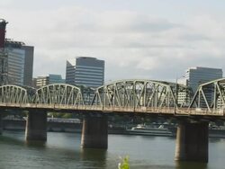 WS PAN View of Hawthorne bridge leading to Portland Oregon city center at sunset and Willamette river in front side / Portland, Oregon, United States  Stock Footage