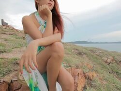 woman sitting on a cliff Stock Footage