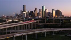 Houston, Texas, USA, highway, city skyline, dusk to night Stock Footage