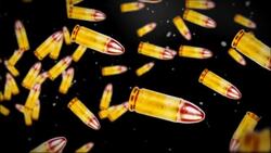 Bullets tumble across a black background. Stock Footage