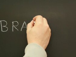 Writing 'Branding' on the blackboard Stock Footage