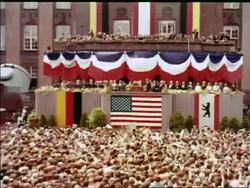 1963 wide shot crowd cheering for President John Kennedy making speech / Berlin / industrial Stock Footage