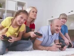HD DOLLY: Family Having Fun Playing Video Games Stock Footage