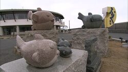 Puffer fish statues line a beach in Japan. Stock Footage