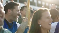 Stadium crowd cheers at football game, various high-fives Stock Footage