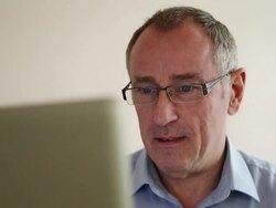 Laptop man wearing glasses. Stock Footage