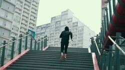 Man running up staircase Stock Footage