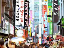 MS People and Sign Board at Myeongdong Shopping area /  South Korea Stock Footage