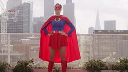 Superhero viewing city from rooftop Stock Footage