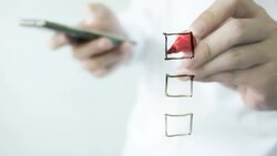 Businessman using smartphone and check mark. Stock Footage