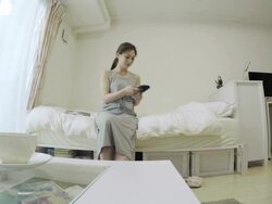 Woman after answer the phone to read magazine in room Stock Footage