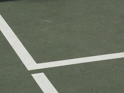 CU ECU of a tennis ball hitting inside the lines. Stock Footage