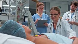 Female doctor checking patient in ICU on her walking round Stock Footage