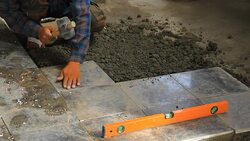 Builders doing tiled floor. Stock Footage
