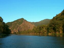 MS View of river near caucasus mountains at sunset / Georgia Stock Footage