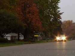 WS Electric car passing through suburb / Rochester, Michigan, United States Stock Footage