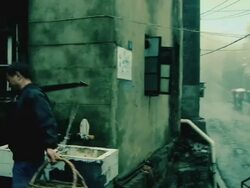 A Chinese man bringing baskets of fish to a Chinese woman on a rainy day.  Stock Footage