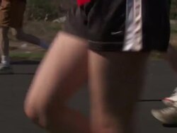 Close Up tracking-left - Runners in shorts and sneakers participating in race Stock Footage
