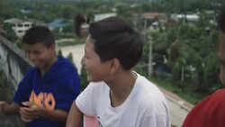 M/S group of Myanmar teenagers playing music in the flat roof of an abandoned building Stock Footage