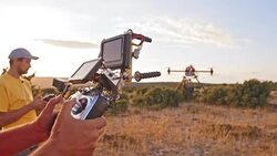 Operator and cameraman operating the drone at takeoff Stock Footage