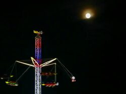 MS T/L Shot of Oktoberfest ride and full moon at night / Munich, Bavaria, Germany Stock Footage