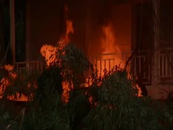 MS View of blazing fire at house / Unspecified Stock Footage