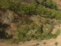 Long Shot aerial - A helicopter flies above farmland in Sri Lanka. / Sri Lanka Stock Footage