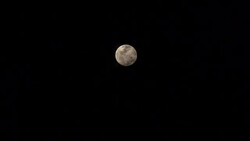 Full moon behind moving clouds Stock Footage